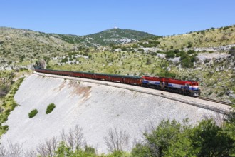 Goods train of the Croatian railway Hrvatske Zeljeznice near Plano, Croatia, Europe