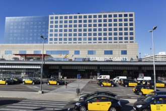 Black and yellow taxis in front of the station building, Barcelona-Sants Central Station,