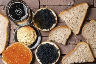 Different kinds of caviar with bread and beverages, AI generated