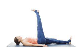 Woman doing yoga asana Uttanpadasana, lying down straight leg raise pose posture isolated on white