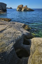 White rocks of famous tourist attraction of Milos island Sarakiniko beach and Aegean sea, Milos