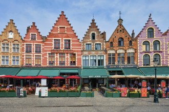 Bruges, Belgium, May 29, 2018: Bruges Grote markt square famous tourist place with many cafe and