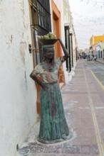 Sculpture statue of Mayan woman carrying bowl of fruit on her head, Campeche city, Campeche State,