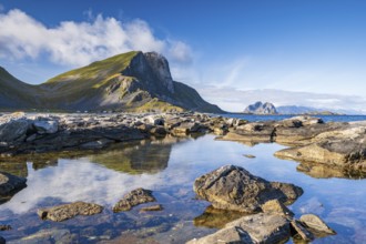 Rocky coast and mountains of the island of Værøy, Vaeroy, Lofoten, Norway, Europe