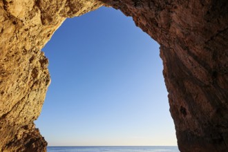 Grotta del Tuona, morning light, boat bow, boat tour, view from the sea, bizarre rock formations,