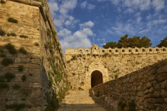 Fortezza, Venetian sea fortress, access ramp, entrance gate, round defence defence tower, blue sky,