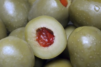 Green olives stuffed with pieces of paprika