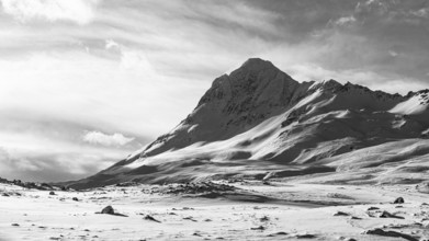 Snow-covered peak of Haafiall Mountain, black and white photo, near Akureyri, Northern Iceland,