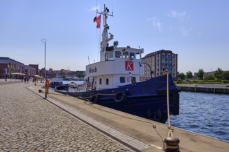 The tugboat BÖSCH lies on the quay in the Old Harbour, Hanseatic City of Wismar,