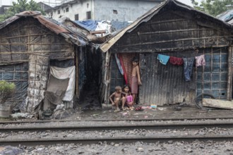 Children in front of their house, which was built right next to the railway tracks, Tejgaon Slum