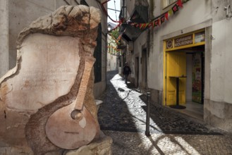 Rua Capelao, on the left a memorial stone for Fado music, Lisbon, Portugal, Europe