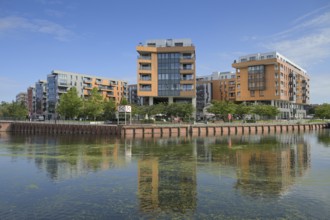 New buildings on the Motlawa River, Stara Stocznia, Gdansk, Pomeranian Voivodeship, Poland, Europe