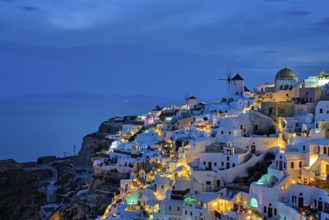 Famous greek iconic picturesque tourist destination Oia village with traditional white houses and