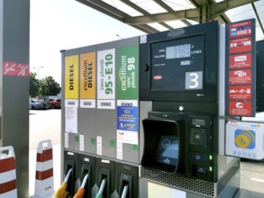 Petrol pump with nozzles for petrol and diesel at a motorway filling station in France, Automatic