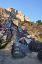 SEORAKSAN, SOUTH KOREA, APRIL 15, 2017: Kyejoam Seokgul Hermitage shrine and Ulsanbawi rock in