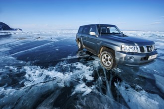 Car on ice, Lake Baikal, Olkhon Island, Pribaikalsky National Park, Irkutsk Province, Siberia,