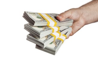 Creative business finance making money concept, hand holding stack of bundles of 100 US dollars