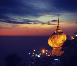 Vintage retro effect filtered hipster style image of Golden Rock, Kyaiktiyo Pagoda, famous Myanmar