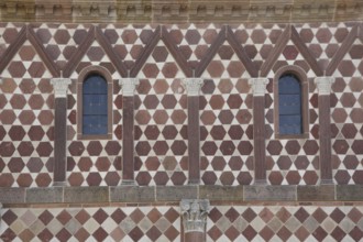 UNESCO Carolingian Monastery, façade of the King's Hall with pilasters and volutes, pattern, red,