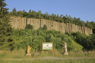 Organ pipes with basalt columns and two wooden sculptures, wooden figures, wood carving, rocks,