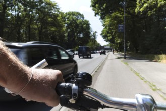 Cycling from a first-person perspective on a cycle path in Cologne, North Rhine-Westphalia,