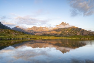 Mount Trehyrna reflected in lake, Nykvåg, Langøya Island, Vesterålen Archipelago, Norway, Europe