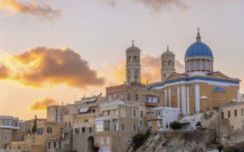 View of the village with the Greek Orthodox church of Agios Nikolaos, Asteria Beach, at sunset with