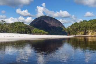 White sand beach before the granite hills of Cerros de Mavecure, Eastern Colombia