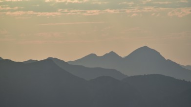 Silhouette of the Sonntagshorn, highest mountain of the Chiemgau Alps, in the backlight, Bavaria,