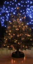 Christmas tree, decorated with tinsel and Christmas baubles, December, Advent, Germany, Europe