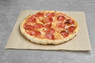 Classic pepperoni pizza on parchment