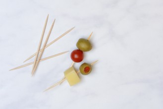 Stuffed olives on toothpicks, green olive