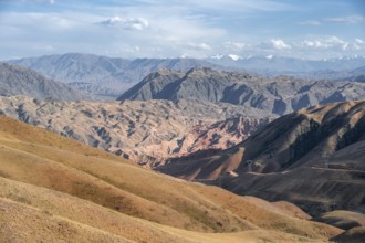 View over eroded mountainous landscape with brown hills, mountains and steppe, Chuy province,