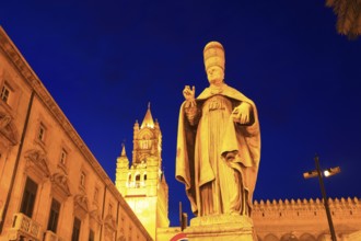 In the old town of Palermo, statue of a saint in front of the west tower of the Cathedral Maria