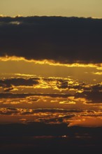 Vibrant colorful clouds in orange and red. Namibia