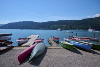 Boats, kayaks, shore, wooden jetty, summer, Lake Millstatt, Millstatt, Carinthia, Austria, Europe