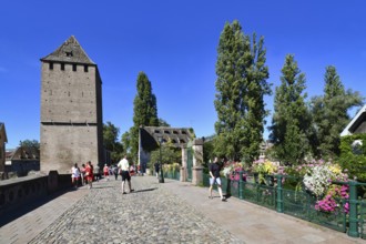 Strasbourg, France, September 2023: People crossing beautiful historic 'Ponts Couvert' bridge with