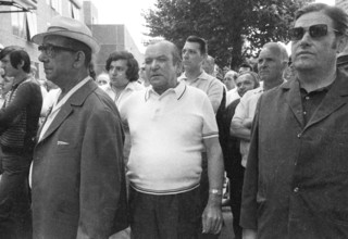 With black flags, mourning and anger, workers of Delog, a factory for flat glass, demonstrated in