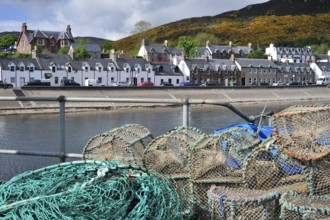 Stacked lobster traps, traps in Ullapool harbour, Highlands, Scotland, UK