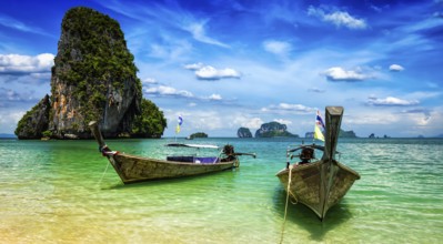 Panorama of long tail boats on tropical beach (Pranang beach), Krabi, Thailand, Asia