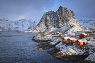 Famous tourist attraction Hamnoy fishing village on Lofoten Islands, Norway with red rorbu houses