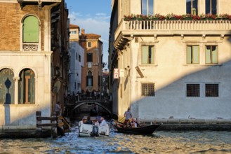 VENICE, ITALY, JUNE 27, 2018: Grand Canal with boats and gondolas on sunset, Venice, Italy, Europe