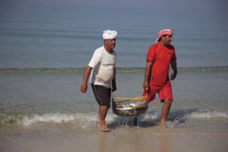 Fishermen on the Arabian Gulf, near Tibat, in the Omani enclave of Musandam, Oman, Asia