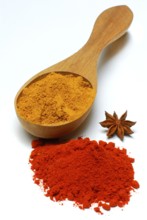 Curry powder in spoon, paprika powder and star anise (Illicium verum)