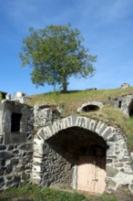 Chateaugay. Wine cellars carved out of the rock. Puy de Dome department. Auvergne Rhone Alpes.