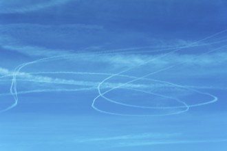 Vapor trail of the airplane in a blue sky. France