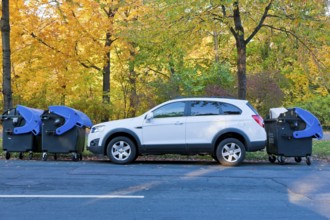 SUV car is delivered by waste paper containers