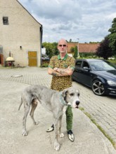 Young man with a Great Dane, Bavaria, Germany, Europe