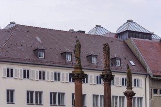 Plague pillars with patron saints in front of the main portal of Freiburg Cathedral on Münsterplatz