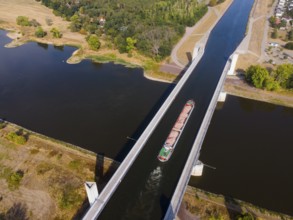 Drone shot, cargo ship on the Mittelland Canal, Magdeburg waterway junction, canal bridge,